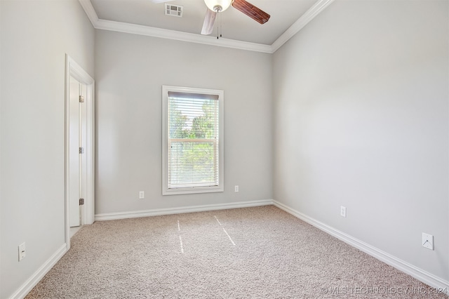 carpeted spare room featuring ornamental molding and ceiling fan