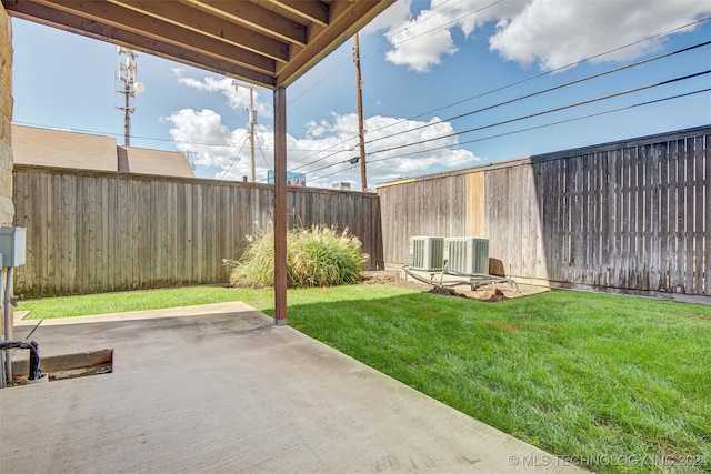 view of yard featuring cooling unit and a patio area