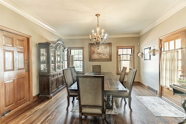 dining room with a notable chandelier, dark hardwood / wood-style floors, and ornamental molding