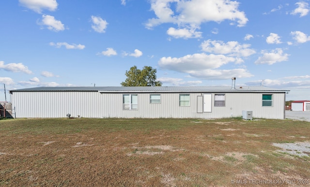 rear view of property featuring central air condition unit