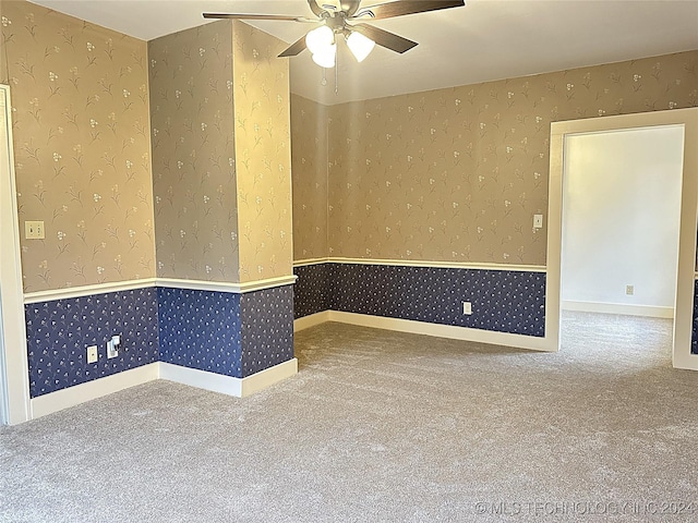 empty room with carpet floors and ceiling fan