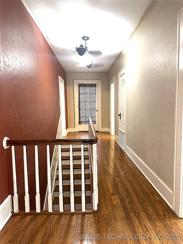 420 K St SW, Ardmore, OK 73401 - corridor featuring wood finished floors, an upstairs landing, and baseboards