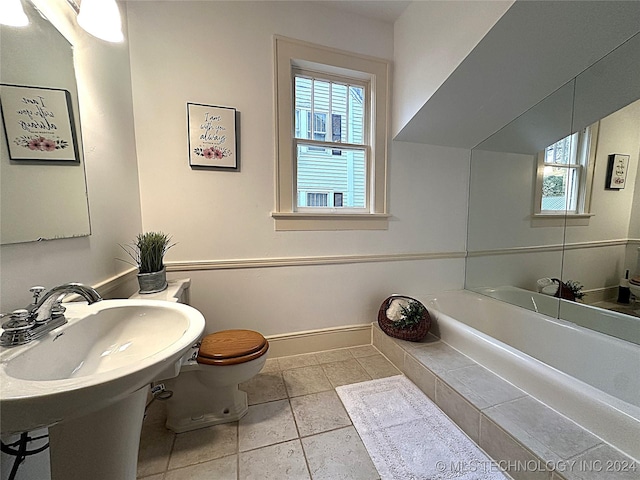 bathroom featuring tile patterned flooring and toilet