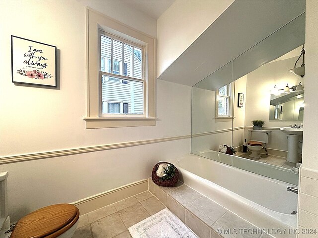 bathroom featuring tile patterned floors and toilet