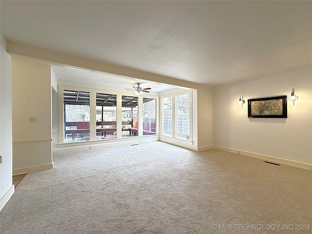 420 K St SW, Ardmore, OK 73401 - carpeted spare room with a ceiling fan and baseboards