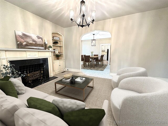 420 K St SW, Ardmore, OK 73401 - carpeted living room with arched walkways, a chandelier, a fireplace, built in features, and baseboards