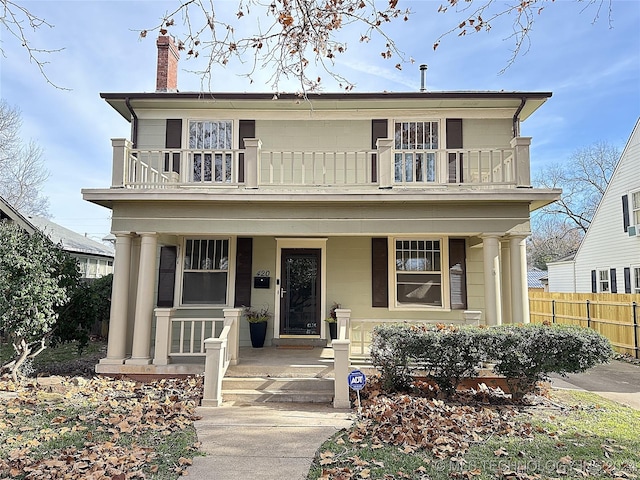 view of front of house with a balcony and a porch