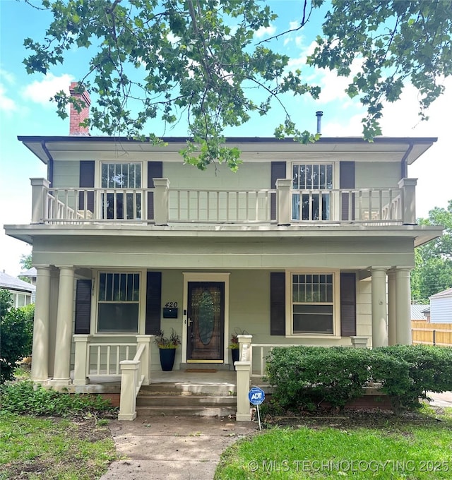 420 K St SW, Ardmore, OK 73401 - view of front of home with a balcony, a porch, and a chimney