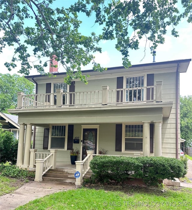 420 K St SW, Ardmore, OK 73401 - view of front of property featuring a balcony, a porch, and a chimney