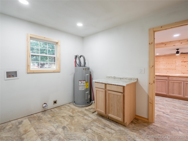 clothes washing area featuring washer hookup, cabinets, electric dryer hookup, water heater, and ceiling fan