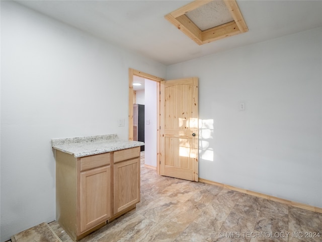 interior space featuring light brown cabinetry