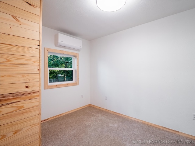 carpeted empty room with a wall mounted air conditioner