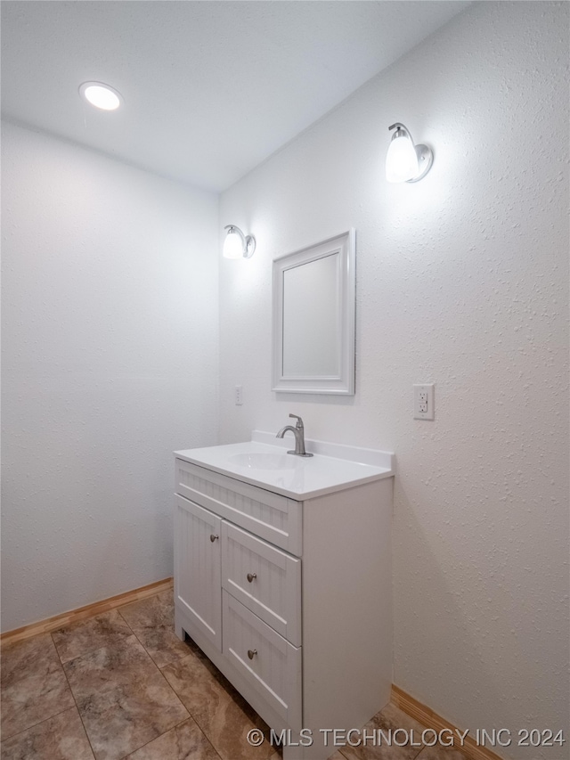 bathroom with tile patterned flooring and vanity