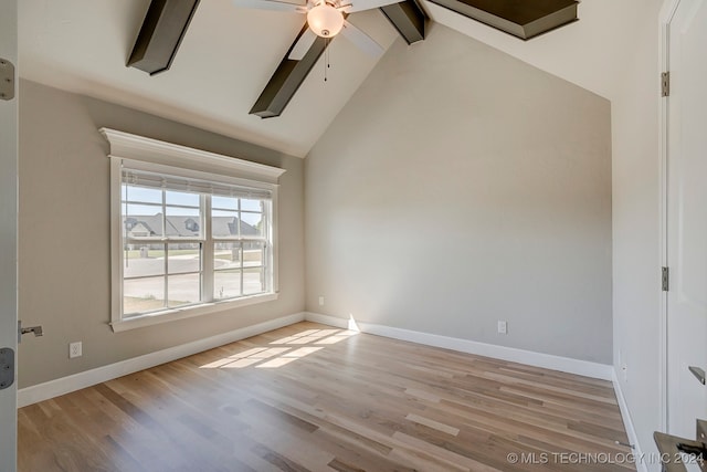 unfurnished room with lofted ceiling with beams, light hardwood / wood-style floors, and ceiling fan