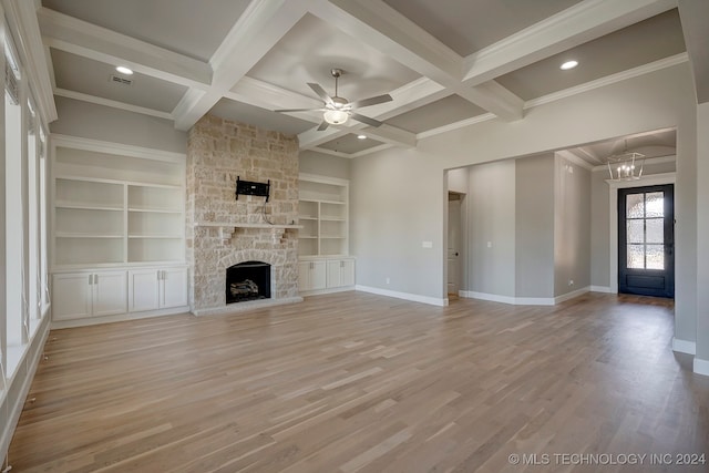 unfurnished living room with coffered ceiling, beam ceiling, and light hardwood / wood-style flooring