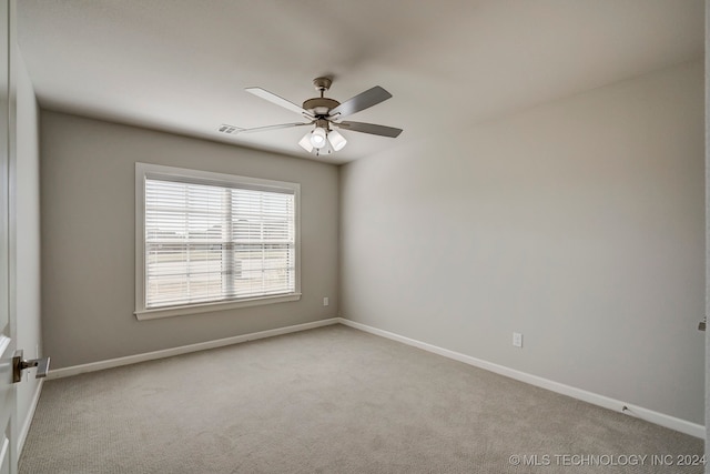 unfurnished room featuring ceiling fan and light colored carpet