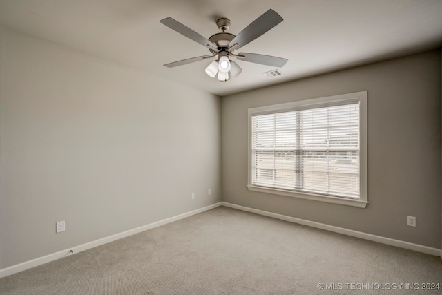 carpeted empty room with ceiling fan