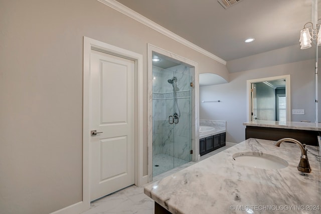 bathroom featuring vanity, separate shower and tub, and ornamental molding