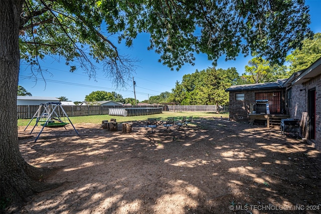 view of yard with a playground