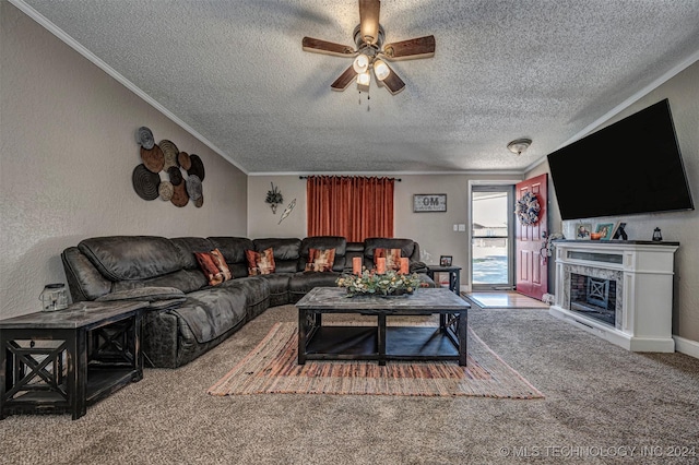 1202 N Pine St, Waurika, OK 73573 - living room with ornamental molding, ceiling fan, a textured wall, a textured ceiling, and carpet floors