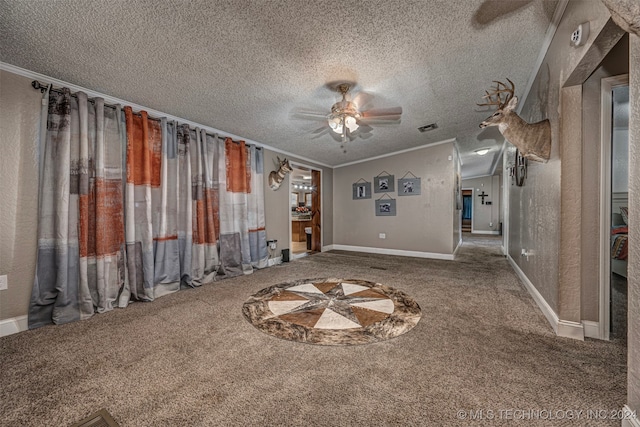 unfurnished living room with a textured ceiling, carpet, ornamental molding, and ceiling fan