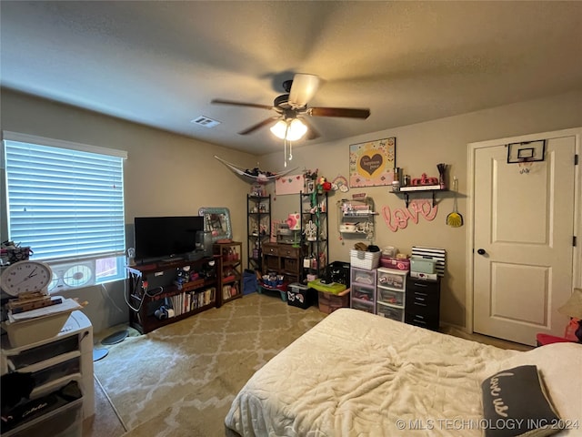 bedroom with ceiling fan and light colored carpet