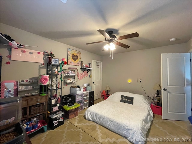 carpeted bedroom with ceiling fan