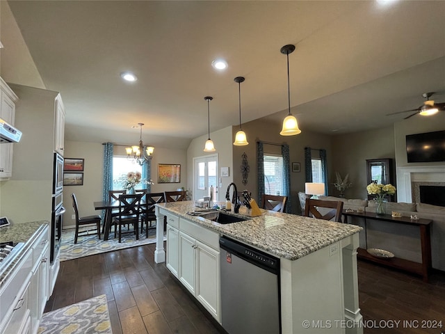 kitchen featuring ceiling fan with notable chandelier, white cabinetry, appliances with stainless steel finishes, and sink