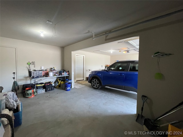 garage featuring ceiling fan and a garage door opener