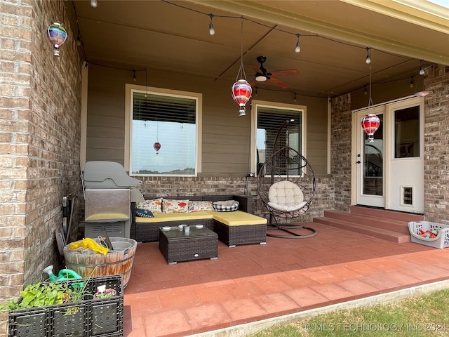 view of patio / terrace with an outdoor living space, ceiling fan, and grilling area