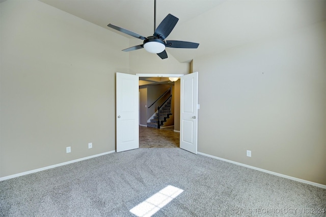 unfurnished bedroom featuring lofted ceiling, ceiling fan, and carpet flooring