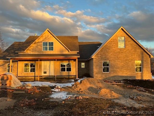 view of back house at dusk