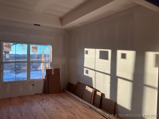 unfurnished room featuring light hardwood / wood-style floors