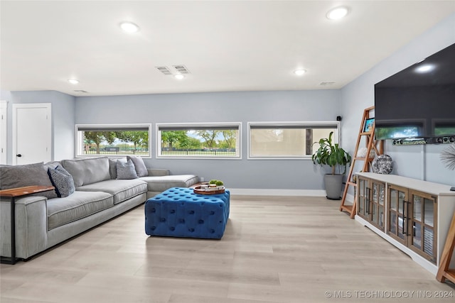 living room with light hardwood / wood-style flooring