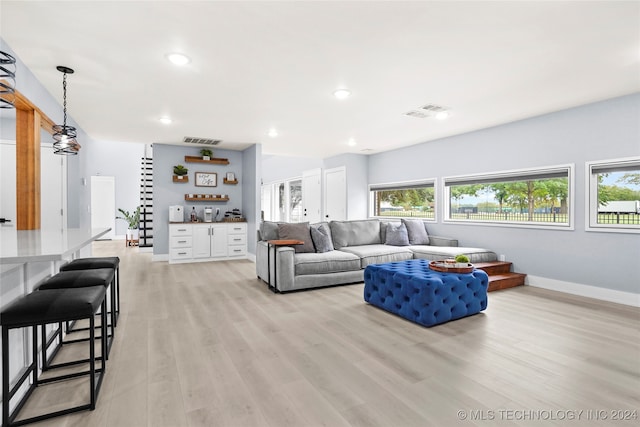 living room with light hardwood / wood-style flooring