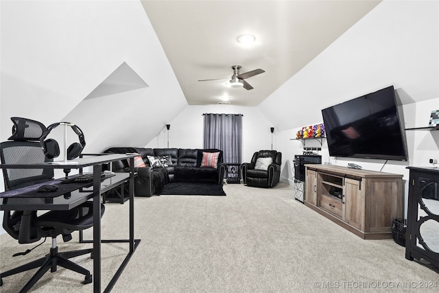 office space featuring lofted ceiling, light carpet, and ceiling fan