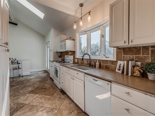 kitchen featuring sink, lofted ceiling with skylight, white appliances, and white cabinetry