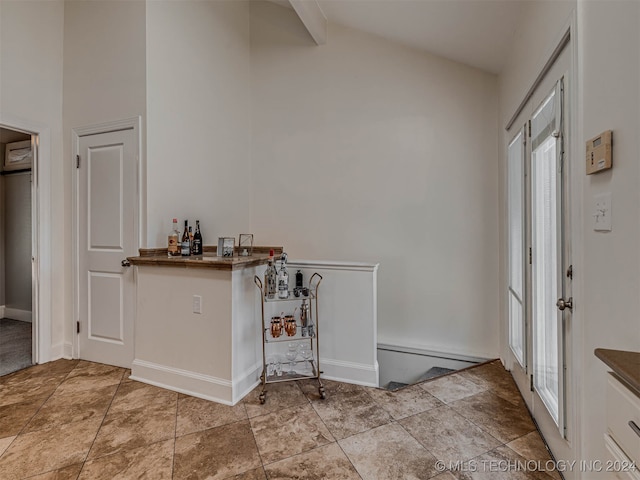 foyer entrance with lofted ceiling and a wealth of natural light