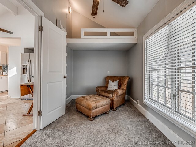 sitting room with carpet floors, lofted ceiling, plenty of natural light, and ceiling fan