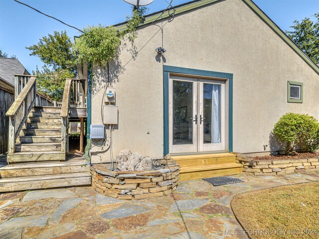 back of house with french doors and a patio area