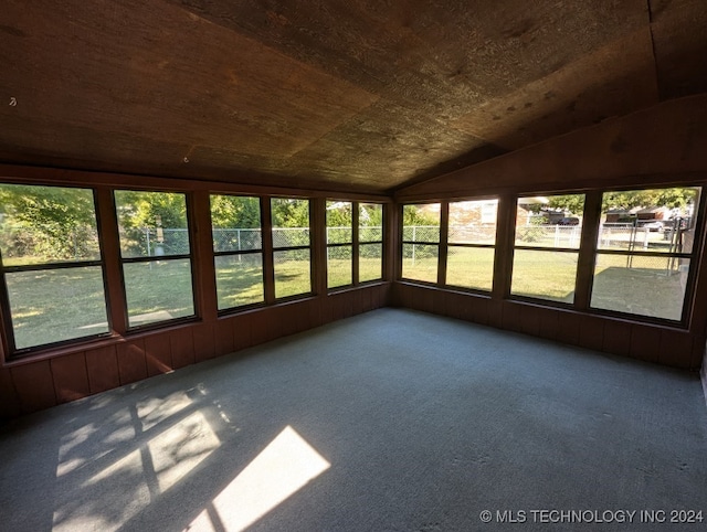 unfurnished sunroom featuring vaulted ceiling