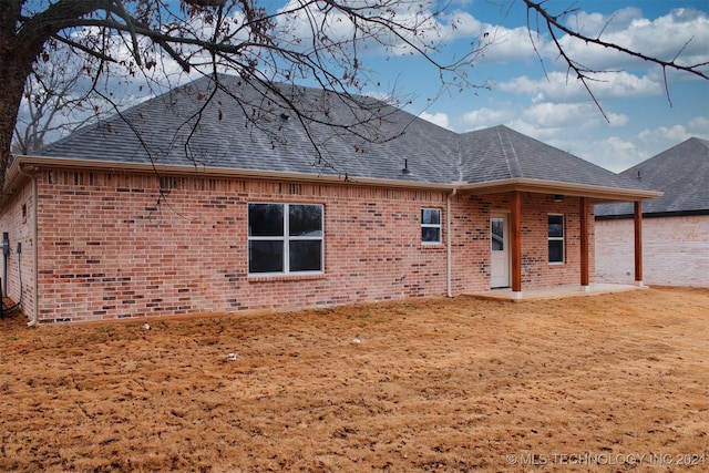 rear view of house featuring a patio