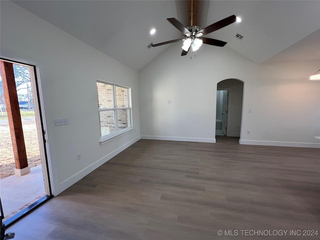 empty room with ceiling fan, a healthy amount of sunlight, and dark hardwood / wood-style floors