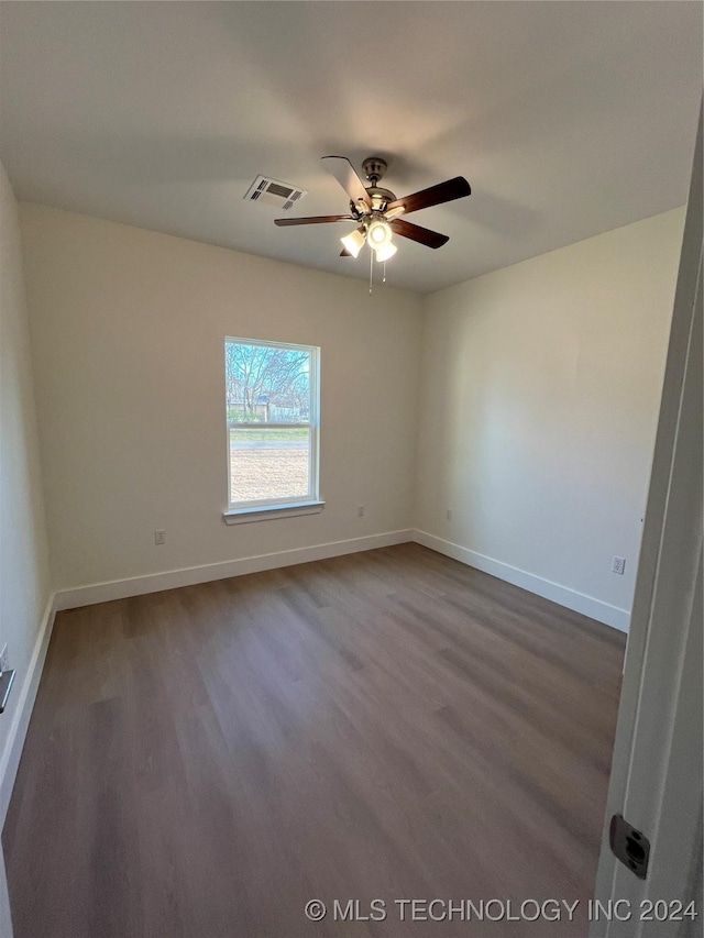 empty room featuring wood-type flooring