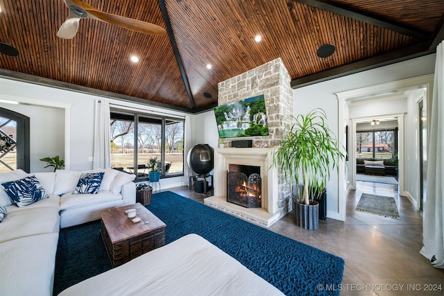 living area with a large fireplace, wooden ceiling, concrete flooring, and a wealth of natural light