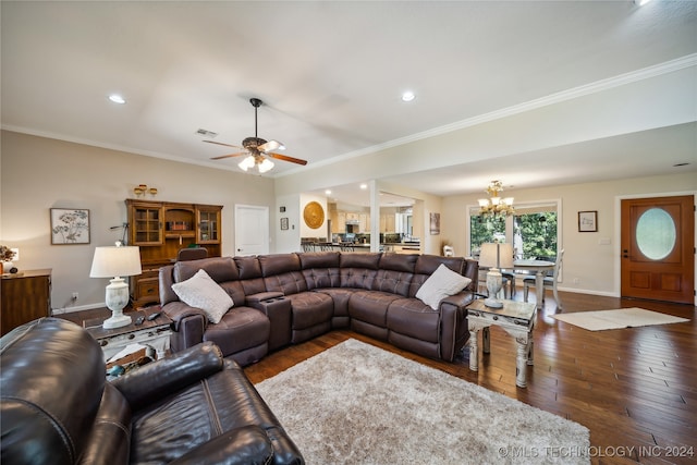 living room featuring ceiling fan with notable chandelier, crown molding, and dark hardwood / wood-style floors