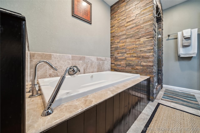 bathroom featuring a tub to relax in and tile patterned flooring