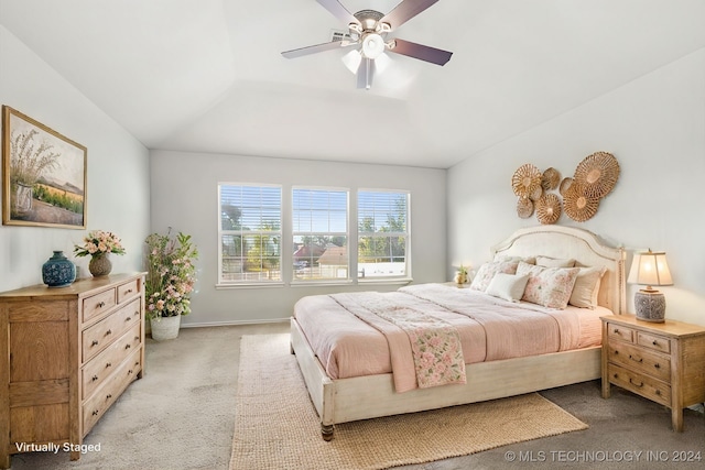 bedroom with ceiling fan and light carpet