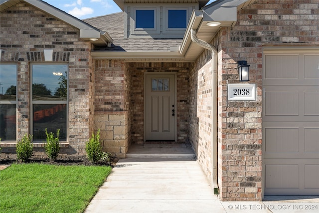 entrance to property featuring a garage