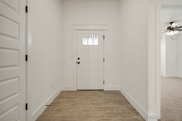 entryway featuring light wood-type flooring and ceiling fan